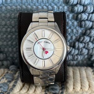 Silver Betsy Johnson. Mother of pearl center dial face. No box. Gently used